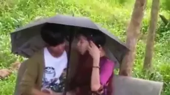 Oral Sex - Indian teenage skank blowing under Umbrella