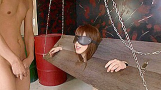 Excited Oriental Skank Blows Cock In The Stocks Blindfolded - Bang